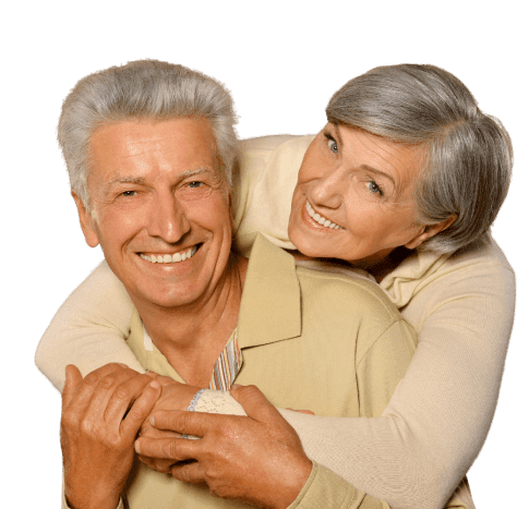 Retired Couple With The Wife Hugging The Husband Over The Shoulder